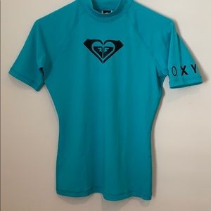Roxy teal green rash guard tee.